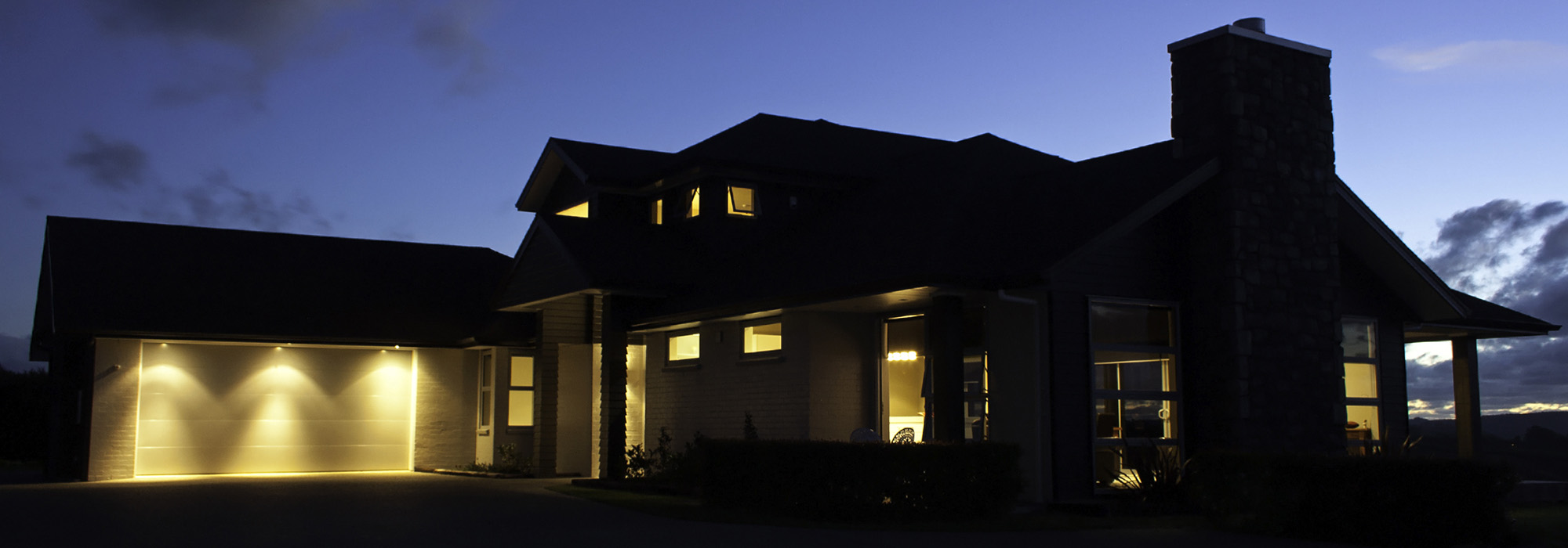 Modern house exterior with lighting at night